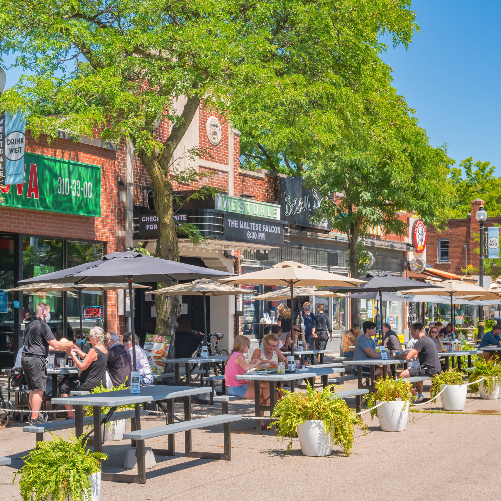 People dine outdoors on restaurant patio
